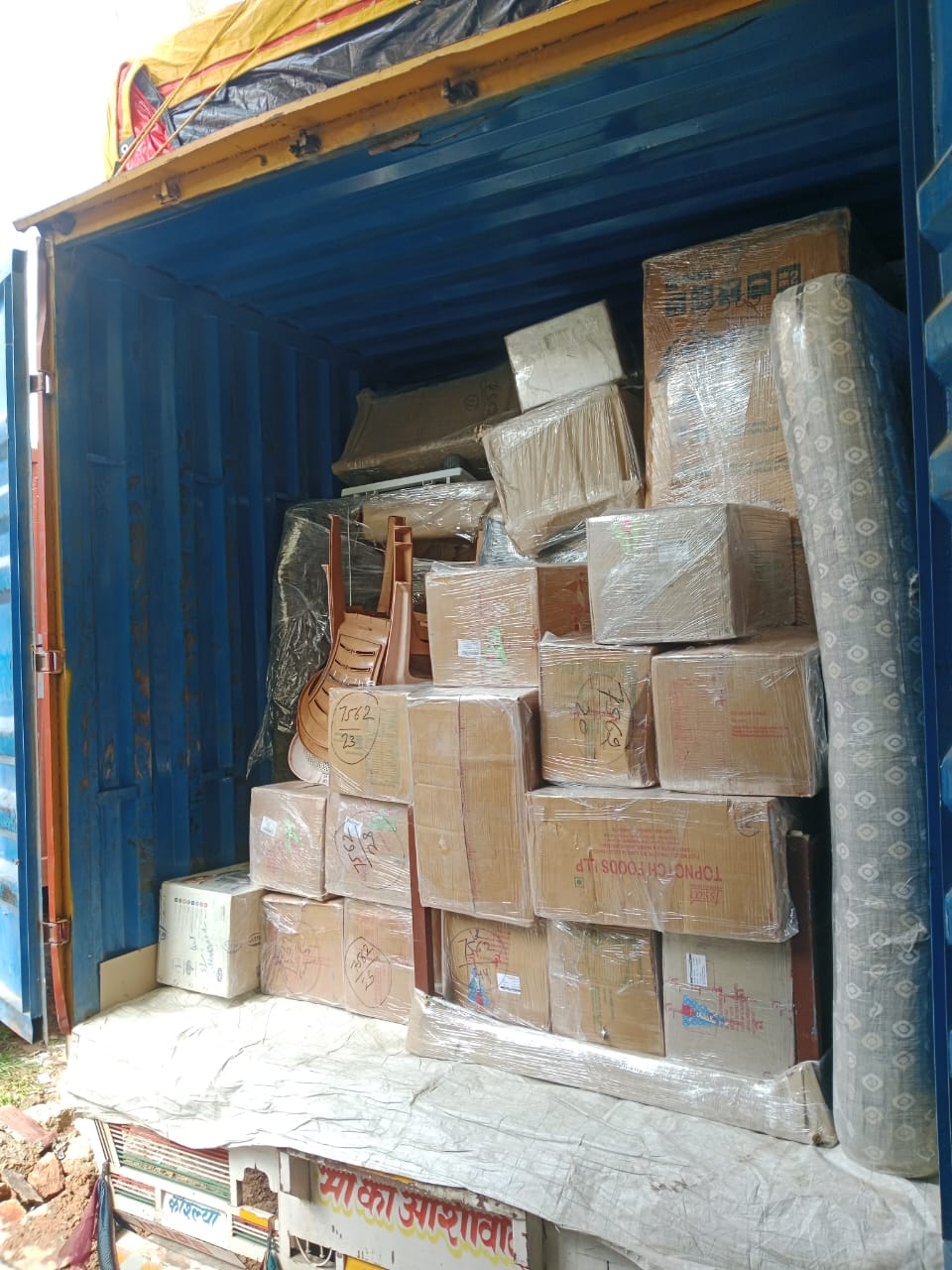 Professional movers packing furniture